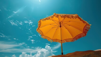 Yellow Beach umbrella on the sandy coast by the sea