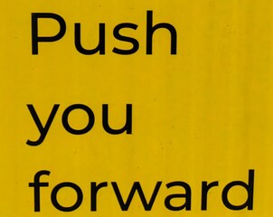 Fototapeta premium Push Your Forward: Message in Black Letters, on the yellow wall background.
