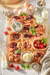 Fresh and hot strawberry yeast cake made of yeast dough.