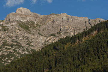 Serles Mountain in Stubaital stands tall during a summer sunset, showcasing a stunning view in Tyrol, Austria.