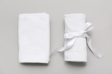 Composition with clean soft towels on grey background