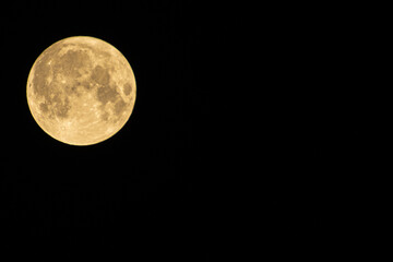 Full moon against a black sky

