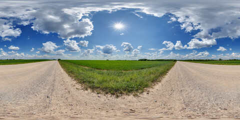 hdri 360 panorama of blue sky with awesome clouds on gravel road among fields in equirectangular full seamless spherical projection, for VR AR content or skydome replacement