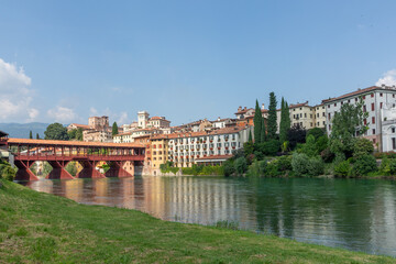 view to historic skyline of Bassano del Grappa with the Old wooden Bridge, also called ponte degli Alpini, Italy