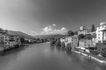 view to historic skyline of Bassano del Grappa with the Old wooden Bridge, also called ponte degli Alpini, Italy