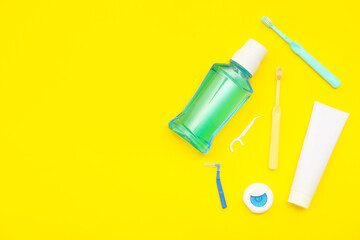 Set for oral hygiene on yellow background