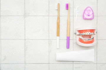 Set for oral hygiene on tile background