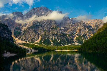 At Lake Braies in the morning on holiday in South Tyrol. A mountain in the Alps in the background