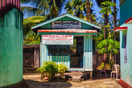 Bago, Myanmar - December 02 2012 : a view of details of the famous decorations at the golden colored Shwe Maw Daw pagoda and fortune telling booth
