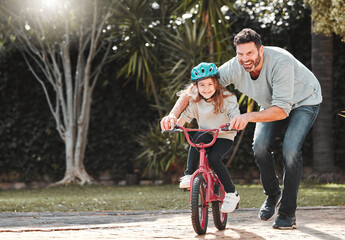 Dad, daughter and learning with ride on bicycle for teaching, lesson or practice at outdoor park....