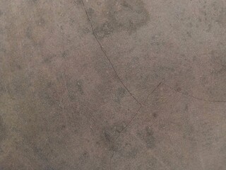Close-up of a cracked building wall textured background. Suitable for additional design projects.