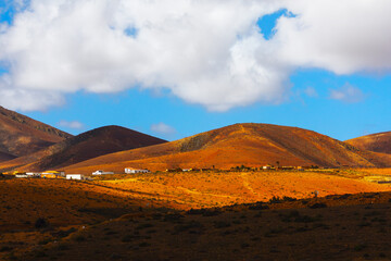 Village on the Island of Fuerteventura, Canary Islands, Spain. Beautiful landscape with a few houses on the side of a hill on the island
