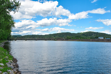 Susquehanna River reflects the blue sky with greenery on the mountains