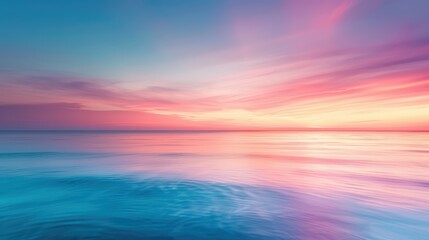 Obraz premium Stunning Sunset Over Calm Ocean with Vibrant Pink and Blue Sky Reflections