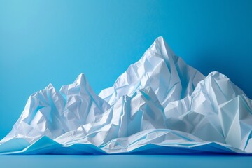 Obraz premium mountains mmade from folded paper, 3D, bright blue background 
