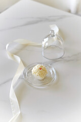 Macarons, glass, marble table