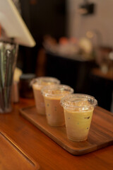 Closeup of Iced Caramel Macchiato at the coffee shop, Caramel Macchiato is a classic macchiato beverage. It consists of vanilla syrup, espresso, steamed milk, foam, and caramel drizzle