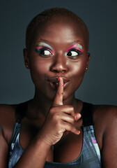 Makeup, memory and black woman in studio for secret, beauty and cosmetics for self care. Model girl, finger and mouth or idea for eyeshadow, art deco or aesthetic for glow or shine by dark background