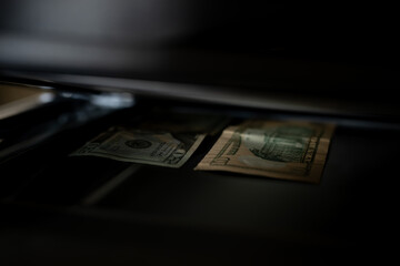 Using a copy machine to print forgery currency. 
