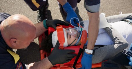Paramedic, emergency and injury on road from car crash accident with healthcare, EMT man and first...