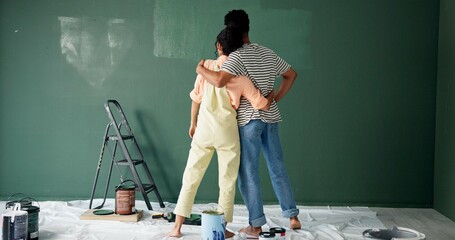 Back, couple and hug with painting wall for house renovations, upgrade and bonding. New home,...