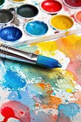 Obraz premium Vibrant Watercolor Pencil Pattern and Paintbrush with Color Palette on White Background