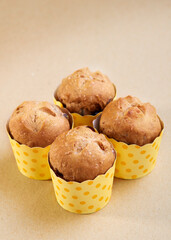 Walnut wholemeal muffins on brown background