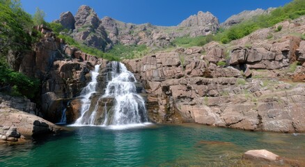 Stunning waterfall in rocky mountain landscape