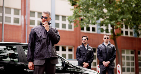 Luxury car business security guard providing VIP protection services, equipped