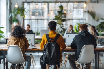 Students Working on Laptops in a Modern Office Space