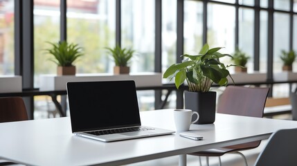 A high-resolution photo of a clean and modern office workspace with a laptop and notepad, soft natural light.