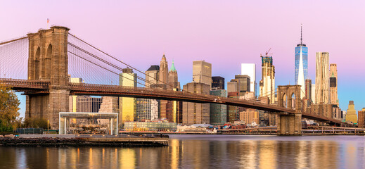 Panorama of Manhattan skyline at sunrise from Brooklyn Bridge Park