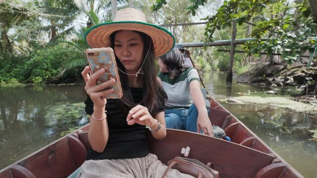Family group travel in floating market by wooden boat local village Maeklong Thailnad