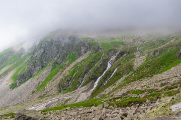 Dramatic Waterfall Cascading Down a Rocky Slope in the Zillertal