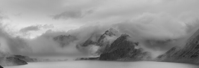 Ethereal Landscape: Misty Peaks Above the Lünersee
