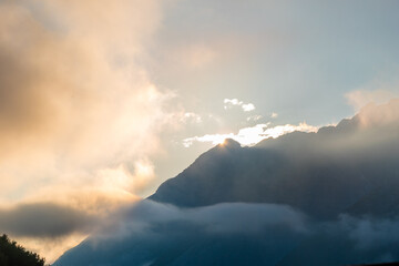 Endless Horizons: Golden Sunset Over Mountain Range