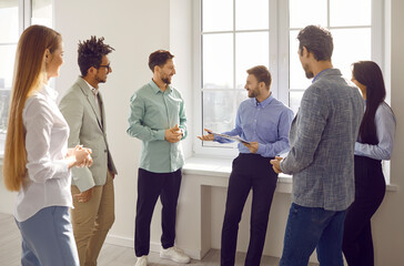 Diverse business team having a meeting with a team coach or a corporate manager. Group of young...