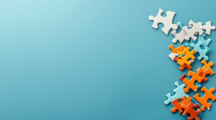 Colorful puzzle pieces on a blue background, leaving copy space for text.