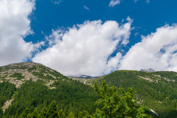 Fototapeta premium Endless Horizons: Alpine Mountain Range with a waterfall (Zillertal, Austria)