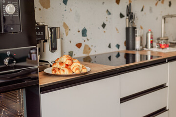 Baking homemade croissants in white pans