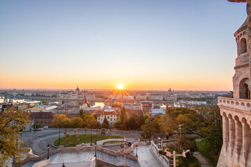 An incredible city view at sunrise or sunset. Extensive city panorama with historical buildings on...