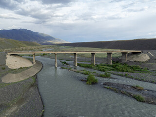Fototapeta premium The old bridge on the River Yrgaity and Dzungarian Gate in East Kazakhstan region.