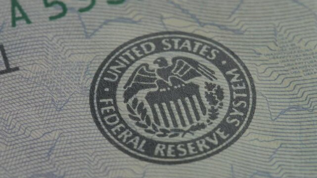 United States Federal Reserve System seal on US Dollar Bill close up macro shot.