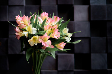 Bouquet of beautiful flowers on a dark background