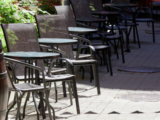 Tables of a summer cafe on the street