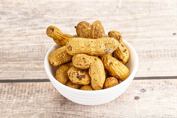 Raw ripe unpeeled peanut heap