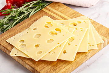 Sliced maasdam cheese with holes