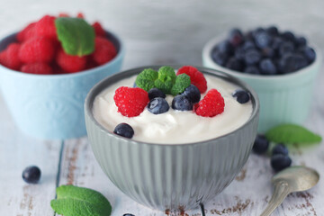 A bowl with Greek yogurt with berries