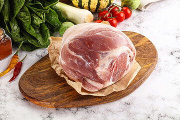 Uncooked raw pork knuckle with spices