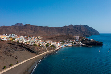 A breathtaking view of the town Las Playitas nestled between rugged mountains and the azure Atlantic. This stunning Fuerteventura landscape captures the essence of the Canary Islands' unique beauty.